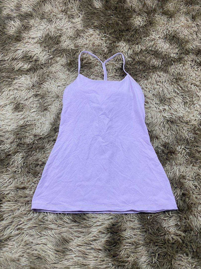 Lululemon Light Purple Tank Top Size 6 (Category: Sleeveless) located in Cagayan de Oro. Submitted by sepamorash53558 (Listing ID 1468264307, Image 1). Description: - Brand: Lululemon - Color: Light purple - Size: 6 (tag located inside the bra pocket) - Features: Built-in shelf bra, strappy racerback design, silver logo on the back - Condition: Pre-loved with a small brownish stain near the logo on the lower back area.