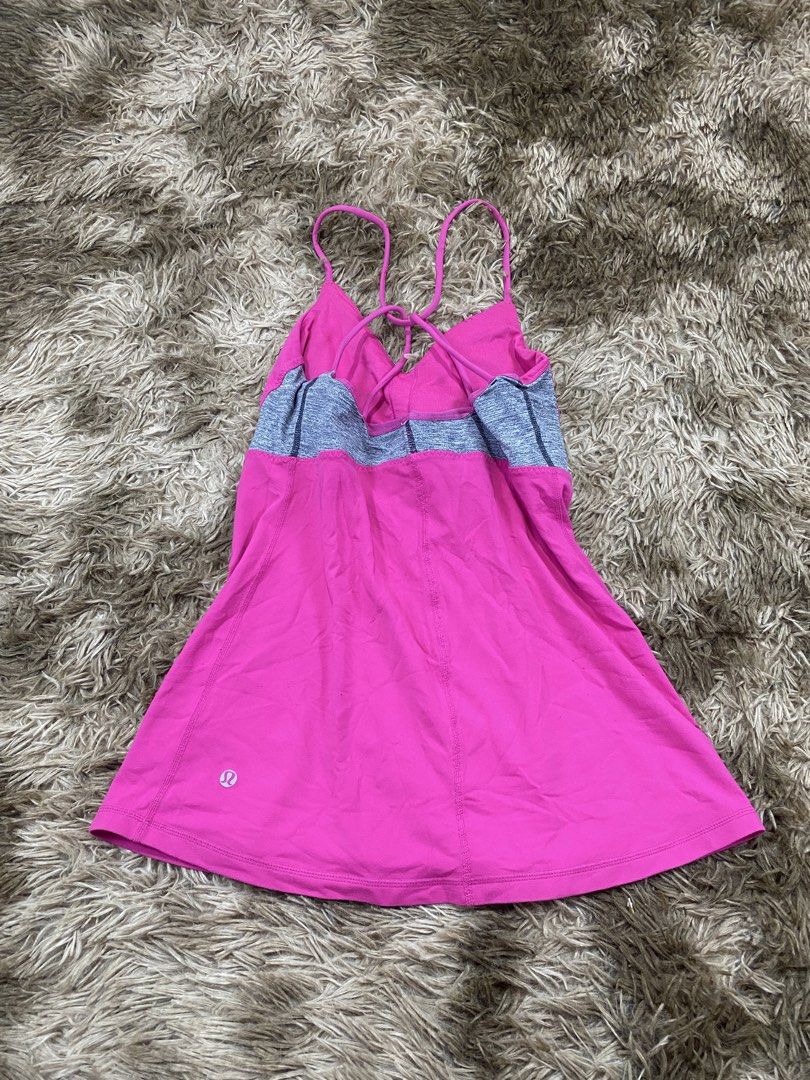 Lululemon Pink Activewear Tank Top Size 10 (Category: Sleeveless) located in Cagayan de Oro. Submitted by sepamorash53558 (Listing ID 1468264308, Image 2). Description: - Brand: Lululemon - Size: 10 - Color: Bright pink with grey contrast panels - Features: Built-in bra cups and chic thin strap crisscross back design - Ideal for: Yoga, gym workouts, and active lifestyle.