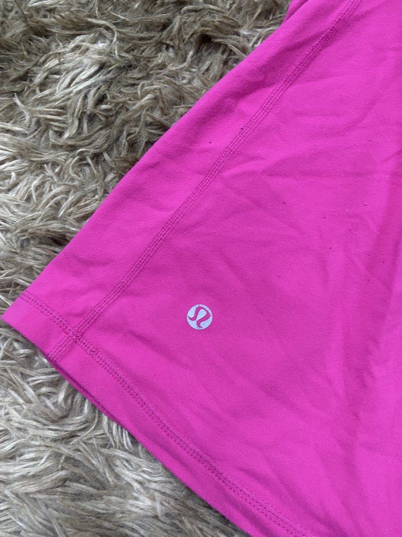 Lululemon Pink Activewear Tank Top Size 10 (Category: Sleeveless) located in Cagayan de Oro. Submitted by sepamorash53558 (Listing ID 1468264308, Image 3). Description: - Brand: Lululemon - Size: 10 - Color: Bright pink with grey contrast panels - Features: Built-in bra cups and chic thin strap crisscross back design - Ideal for: Yoga, gym workouts, and active lifestyle.