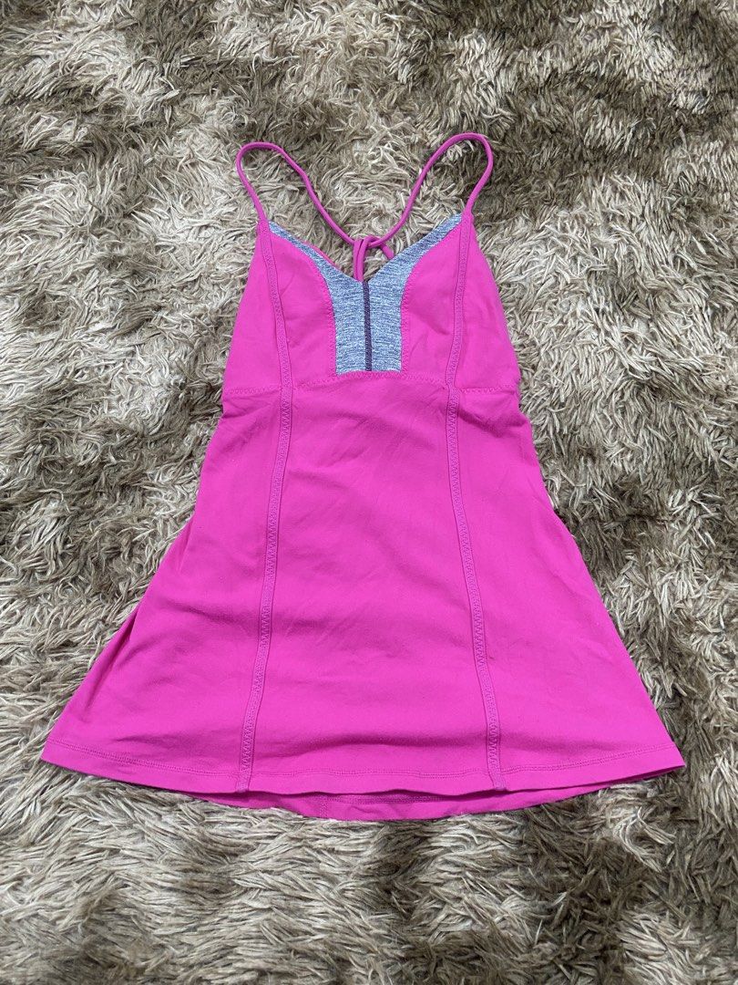 Lululemon Pink Activewear Tank Top Size 10 (Category: Sleeveless) located in Cagayan de Oro. Submitted by sepamorash53558 (Listing ID 1468264308, Image 1). Description: - Brand: Lululemon - Size: 10 - Color: Bright pink with grey contrast panels - Features: Built-in bra cups and chic thin strap crisscross back design - Ideal for: Yoga, gym workouts, and active lifestyle.