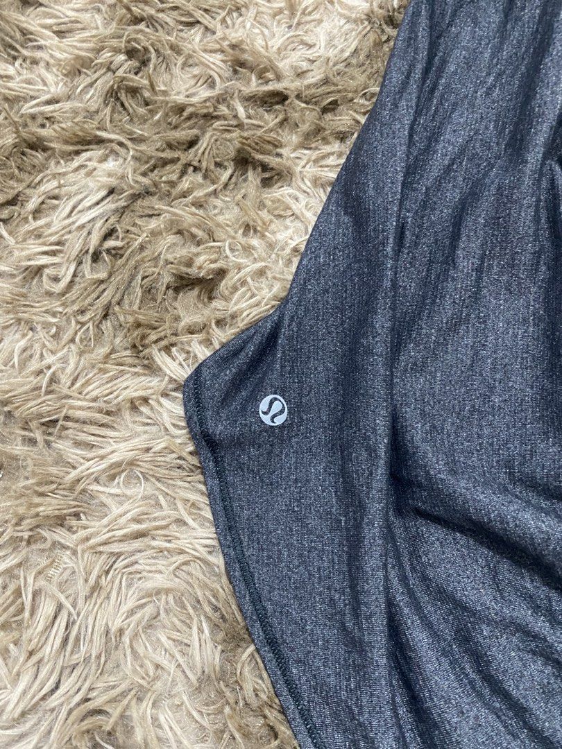 Lululemon Strappy Back Tank Top Grey Size 8 (Category: Sleeveless) located in Cagayan de Oro. Submitted by sepamorash53558 (Listing ID 1468264312, Image 3). Description: - Authentic Lululemon workout tank top - Color: Dark Grey Heather - Built-in bra with removable pads included - Stunning multi-strap criss-cross back design - Curved hem with extra length in the back for coverage - Signature reflective silver Lululemon logo near hem - Size dot ve