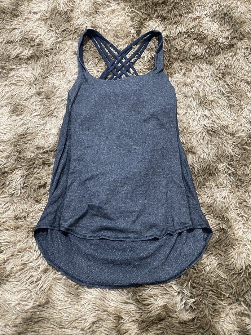 Lululemon Strappy Back Tank Top Grey Size 8 (Category: Sleeveless) located in Cagayan de Oro. Submitted by sepamorash53558 (Listing ID 1468264312, Image 1). Description: - Authentic Lululemon workout tank top - Color: Dark Grey Heather - Built-in bra with removable pads included - Stunning multi-strap criss-cross back design - Curved hem with extra length in the back for coverage - Signature reflective silver Lululemon logo near hem - Size dot ve