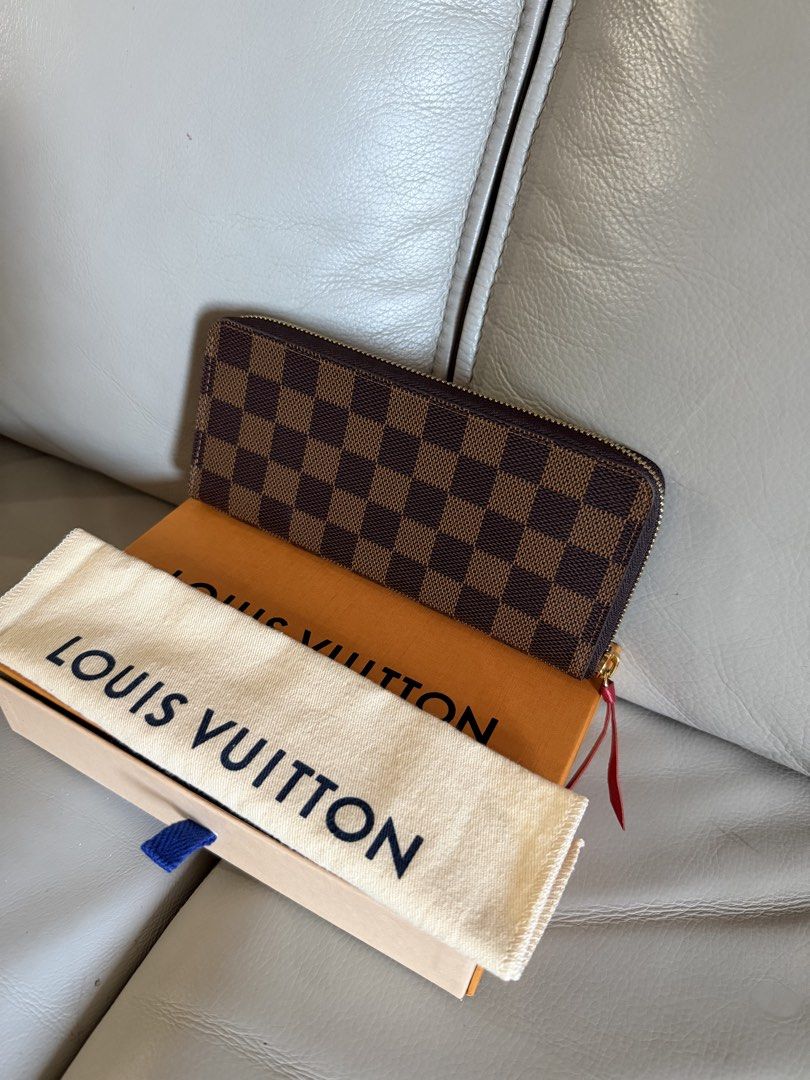LV WALLET CLEMENCE- Damier (Category: Wallets & Card holders) located in Makati City. Submitted by lambogirl (Listing ID 1468189442, Image 2). Description: ✔️The image shows a Louis Vuitton Clémence Wallet in the Damier Ébène canvas with a cherry-red leather zipper pull. ✔️comes complete ✔️free shipping or pick up (Makati).
