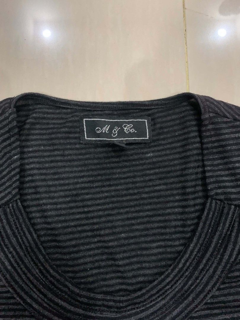 M & Co Striped Short Sleeve Top (Category: Shirts) located in Tiaong. Submitted by cdoswan (Listing ID 1468204266, Image 2). Description: - Brand: M & Co. - Color: Black and grey stripes - Style: Short sleeve top with fitted silhouette - Neckline: Scoop neck with front gathered pleats - Details: Ribbed collar and trim, small branded hem tag - Material: Soft stretch knit - Condition: Great casual everyday basic.