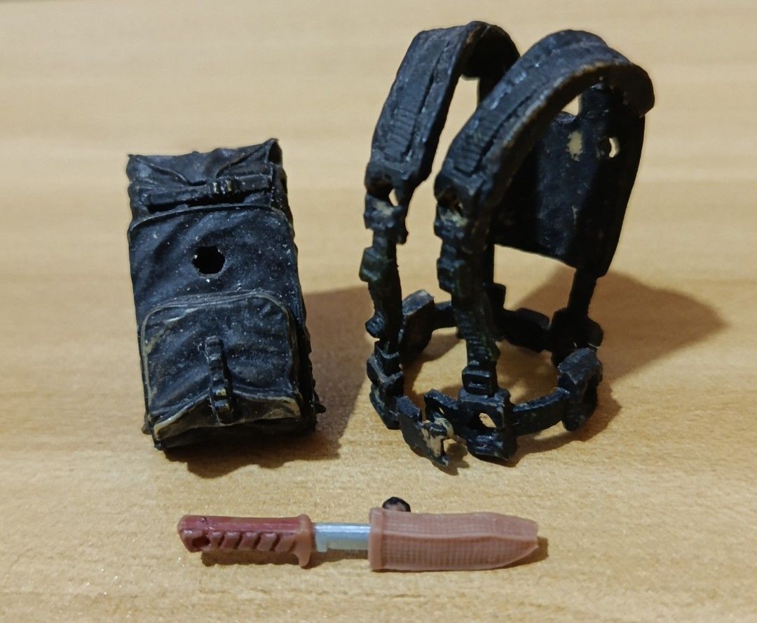 Marauders Gunrunners Tactical Vest Backpack Knife (Category: Action & Battle Toys) located in Ligao. Submitted by travis40 (Listing ID 1468245111, Image 3). Description: - Scale: Fits 3.75 action figures and military dioramas - Gear: Black tactical vest with matching backpack and weathered painted finish - Weapon: Brown handle knife with included sheath - Condition: Loose parts only, missing original packaging.