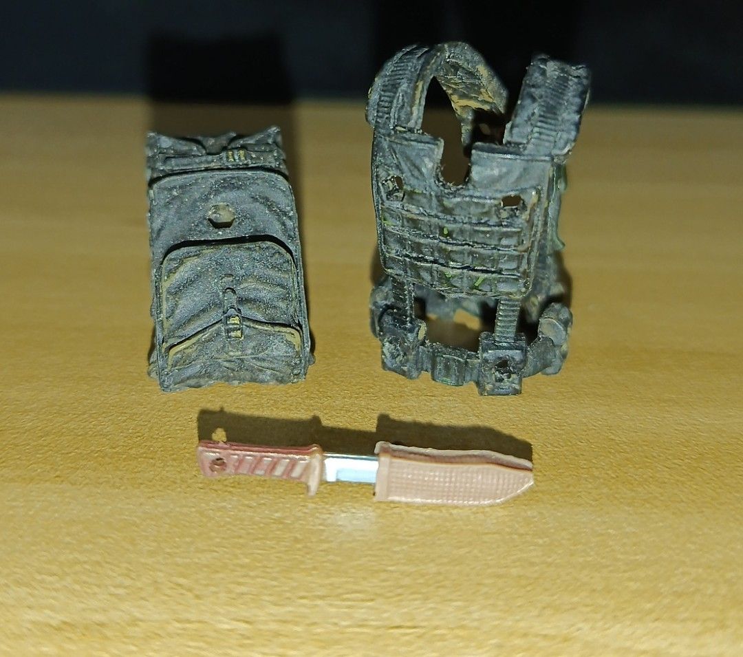 Marauders Gunrunners Tactical Vest Backpack Knife (Category: Action & Battle Toys) located in Ligao. Submitted by travis40 (Listing ID 1468245111, Image 1). Description: - Scale: Fits 3.75 action figures and military dioramas - Gear: Black tactical vest with matching backpack and weathered painted finish - Weapon: Brown handle knife with included sheath - Condition: Loose parts only, missing original packaging.