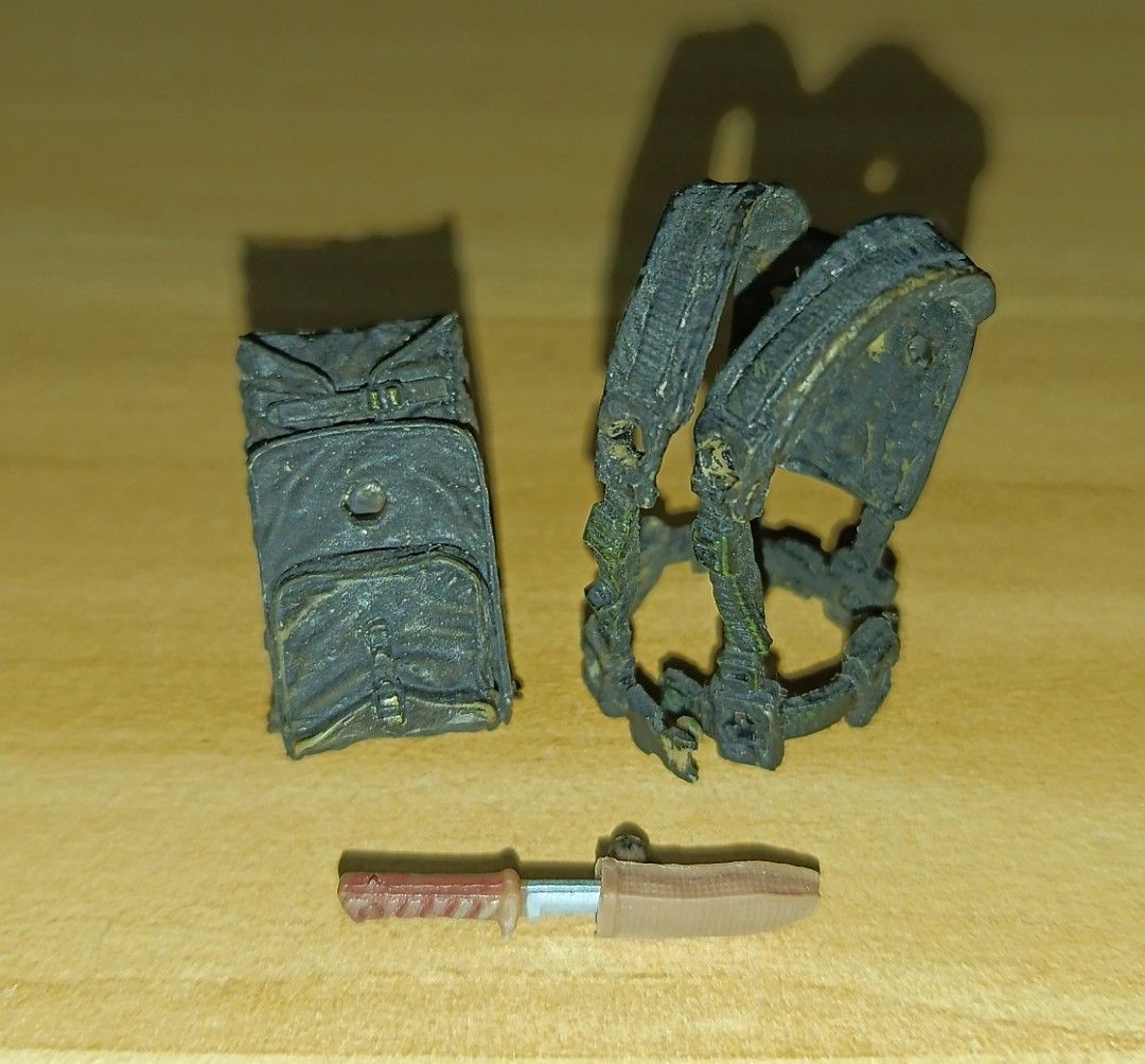 Marauders Gunrunners Tactical Vest Backpack Knife (Category: Action & Battle Toys) located in Ligao. Submitted by travis40 (Listing ID 1468245111, Image 2). Description: - Scale: Fits 3.75 action figures and military dioramas - Gear: Black tactical vest with matching backpack and weathered painted finish - Weapon: Brown handle knife with included sheath - Condition: Loose parts only, missing original packaging.
