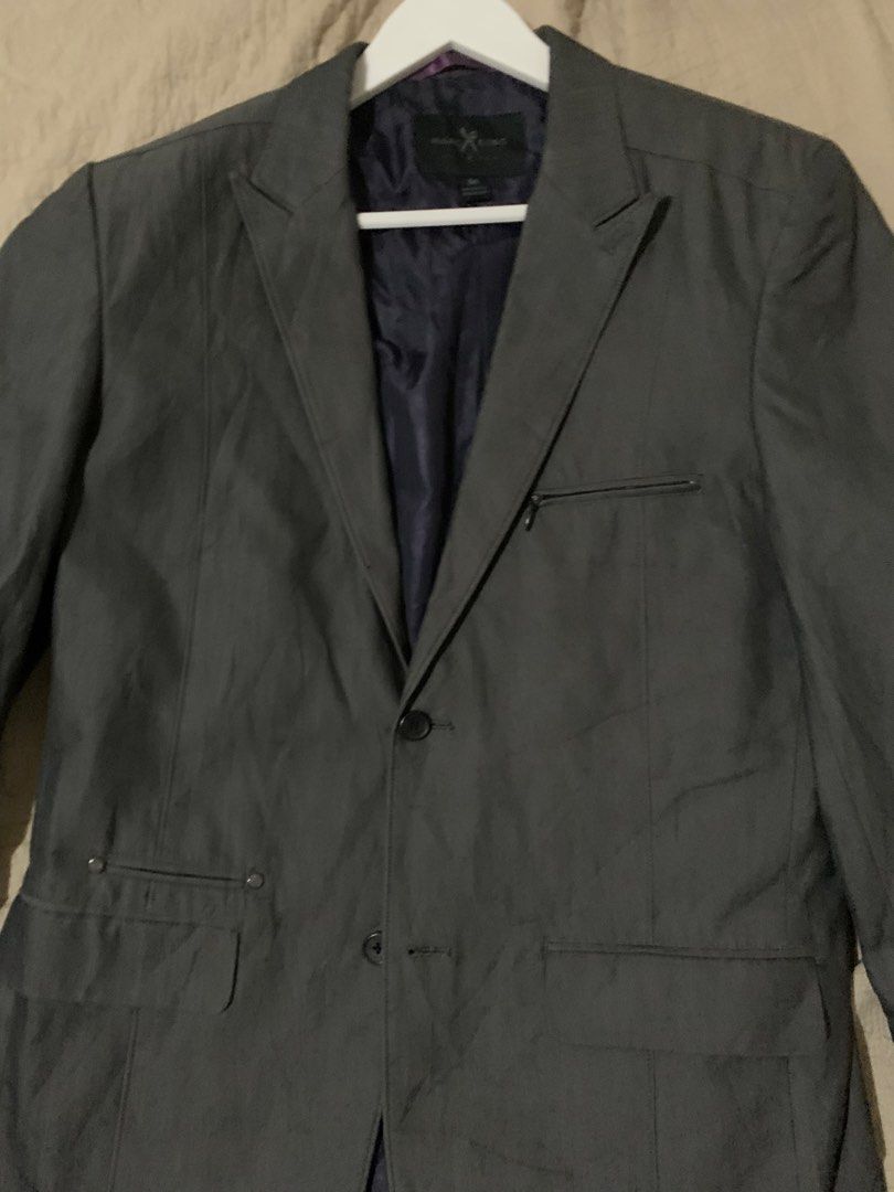 Marc Ecko Charcoal Grey Blazer Jacket (Category: Coats, Jackets and Outerwear) located in Manila. Submitted by spaceshop12345 (Listing ID 1468179087, Image 3). Description: - Brand: Marc Ecko - Color: Charcoal Grey with Dark Purple inner lining - Size: Medium - Style: Casual blazer / jacket - Closure: Two-button front - Pockets: Front flap pockets and zipped chest pocket detail - Condition: Great for dressing up or keeping sharp.