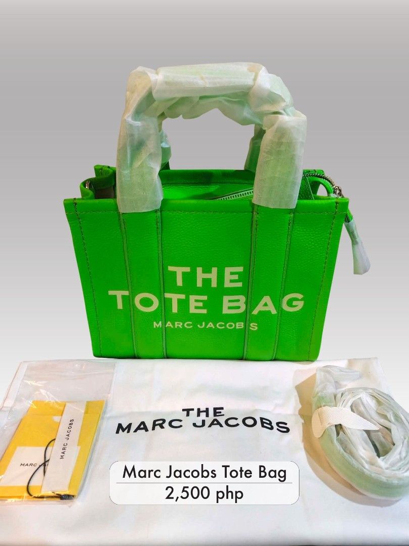 Marc Jacobs The Tote Bag Green Leather (Category: Tote Bags) located in Manila. Submitted by changsluxury (Listing ID 1468181569, Image 1). Description: - Brand: Marc Jacobs - Color: Bright Green - Material: Leather - Size: Medium silhouette - Condition: Brand new with tags, handles wrapped in protective paper - Features: Bold front lettering, secure zipped top closure - Inclusions: Matching green crossbody strap, original dust bag, and tags in o
