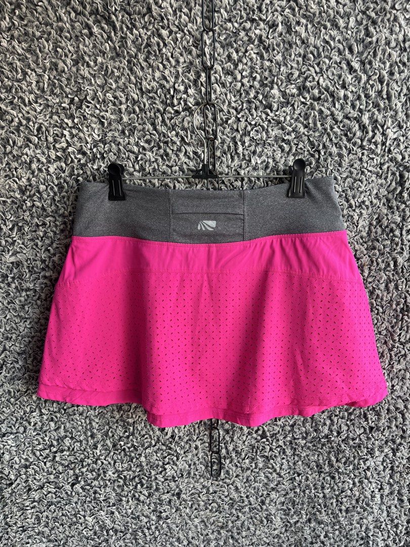 Marika athletic athletic skort | Size M (Category: Skirts) located in General Trias. Submitted by zrchustle.604 (Listing ID 1468280999, Image 1). Description: Marika athletic athletic skort featuring a vibrant fuchsia pink body with laser-cut perforation details for ventilation, paired with a heather gray elastic waistband. The back of the waistband includes a subtle Marika logo emblem along with a small zip storage pocket..