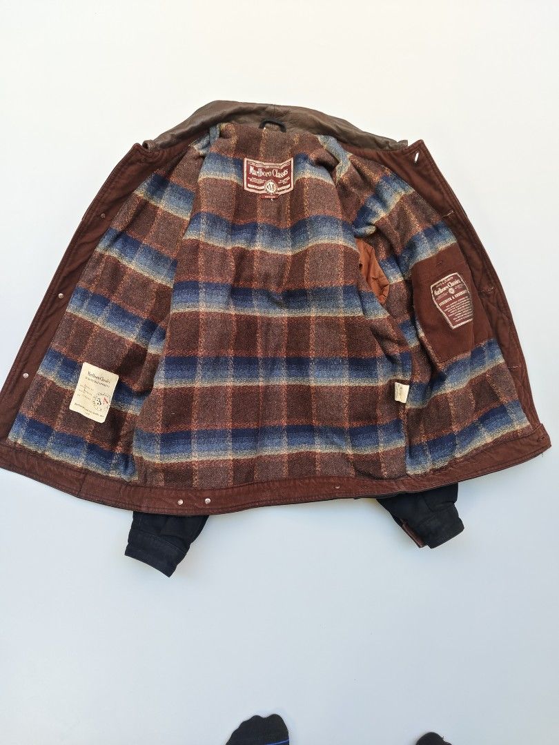 Marlb*ro classics blanket lined (Italy made) (Category: Coats, Jackets and Outerwear) located in Baguio. Submitted by archival_thrifted.ph. (Listing ID 1468141983, Image 3). Description: FOR SALE‼️ .MARLB*RO CLASSICS BLANKET LINED JACKET .MADE IN ITALY 🇮🇹 .💯 AUTHENTIC . EXCELLENT CONDITION .LIGHTLY FADE ON SHOULDER PART BARELY VISIBLE .MEDIUM ON TAG .PHP 3980 PLUS SF .❌❌ COP/COD .MOP GCASH . COURIER J&T .BAGUIO AREA .DM FOR SURE BUYER TY.