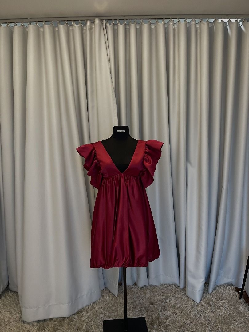 Maroon Mini Dress with Ruffle Sleeves Open Back (Category: Dresses) located in Pasig City. Submitted by icesk8r (Listing ID 1468115319, Image 1). Description: Burgundy satin baby doll dress with dramatic ruffled sleeves and deep v-neck. Fits up to big medium size. Brand new, never worn. Designer made..