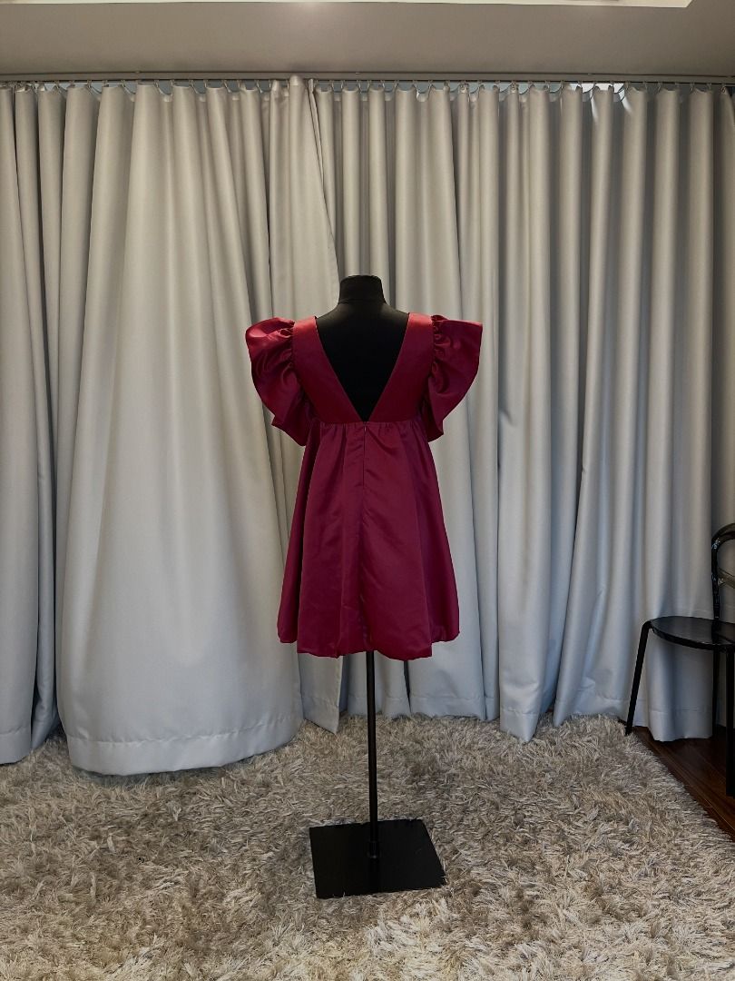 Maroon Mini Dress with Ruffle Sleeves Open Back (Category: Dresses) located in Pasig City. Submitted by icesk8r (Listing ID 1468115319, Image 2). Description: Burgundy satin baby doll dress with dramatic ruffled sleeves and deep v-neck. Fits up to big medium size. Brand new, never worn. Designer made..