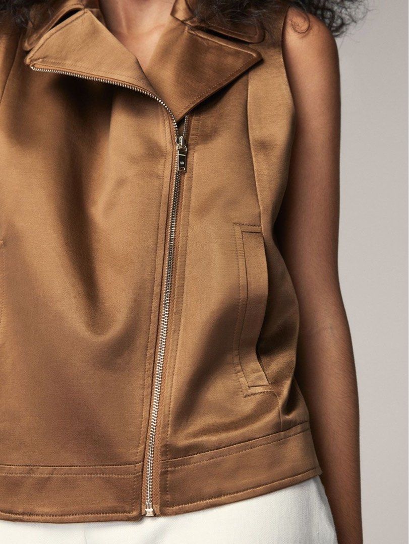 Massimo Dutti Brown Biker Vest (Category: Coats, Jackets and Outerwear) located in Tanza. Submitted by deeclutterer (Listing ID 1468164346, Image 3). Description: - Brand: Massimo Dutti - Style: Sleeveless biker vest / statement layering piece - Color: Metallic bronze / brown - Details: Asymmetric zip closure, wide lapel collar, front slit pockets - Material: Lightweight silky satin with structured tailoring XS on tag fits to Small-Semi medium.