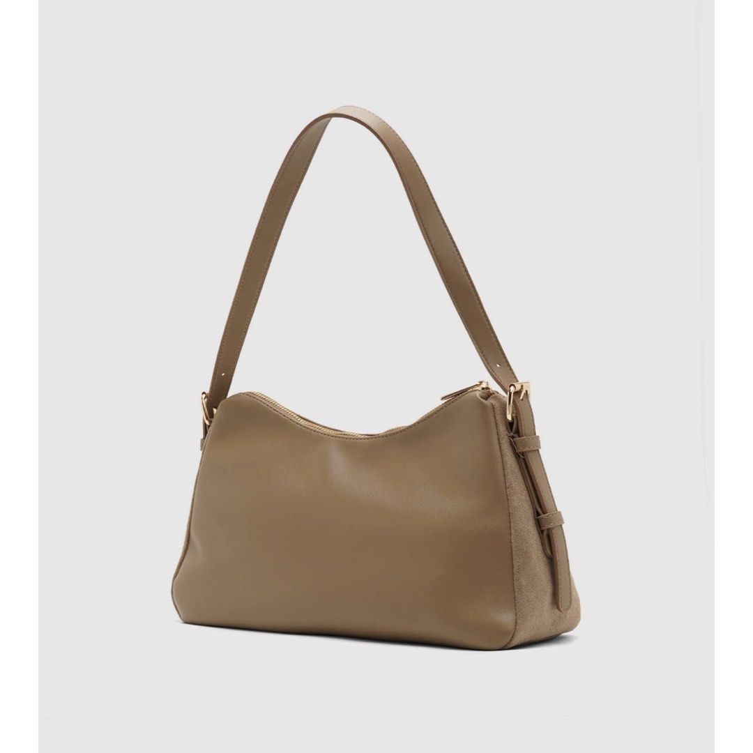 Matthews Venetia Shoulder Bag (Category: Shoulder Bags) located in Bulacan. Submitted by glnnsdclutter (Listing ID 1468254150, Image 2). Description: - Brand: Matthews Venetia - Color: Taupe - Material: Suede-texture panels with smooth sides - Closure & Interior: Secure top zipper with lined interior and extra pocket space - Fit: Clean shape with an easy drop for comfortable shoulder wear - Pricing: Original retail ₱1,999 / Store markdown ₱1,299 