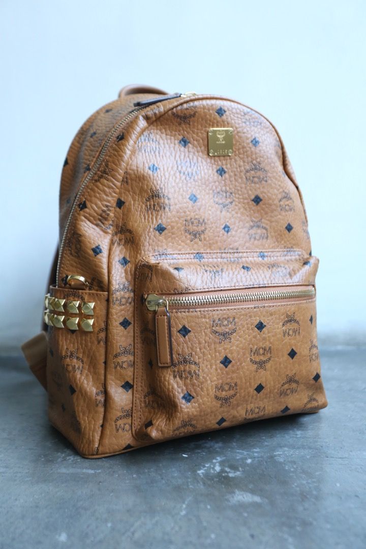 MCM - Stark Side Studs Visetos Backpack (Category: Luxury Bags & Wallets) located in Manila. Submitted by graymatter_ (Listing ID 1468144575, Image 2). Description: MCM - Stark Side Studs Visetos Backpack A pioneer in the realm of everyday luxury, the classic Stark backpack is sculpted from Visetos monogram canvas and nappa leather. Multi-faceted studs frame both sides of the silhouette, personifying the rebellious edge unique to MCM. Matching th