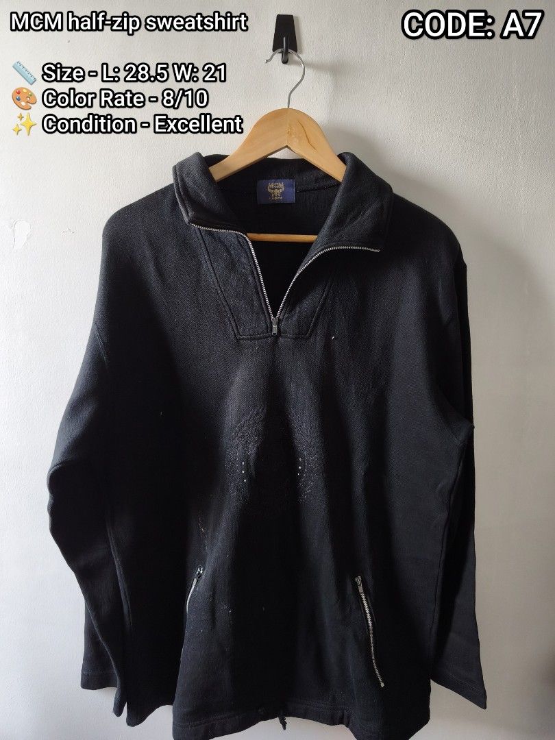 MCM half-zip sweatshirt A7 (Category: Coats, Jackets and Outerwear) located in Manila. Submitted by gelog2 (Listing ID 1468145253, Image 1). Description: - Code: A7 - Brand/Style: Black MCM half-zip sweatshirt - Size: L (Measures 28.5" length x 21" width) - Features: Metal zippers on collar and two front pockets - Details: Subtle embroidered logo graphic centered on chest - Condition: Thick, durable material with color rated 8/10 - Best for: Soli