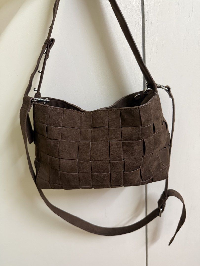 Medium Woven Frame Bag in Suede Cocoa (1.0) (Category: Shoulder Bags) located in San Juan City. Submitted by candycane27 (Listing ID 1468074781, Image 1). Description: - Color & Material: Brown woven suede - Closure: Top zip closure - Hardware: Silver tone throughout - Interior: Lined compartment, clean inside and out - Strap: Adjustable shoulder strap - Capacity: Comfortably holds daily essentials - No bag - No damages / marks - Still new - will