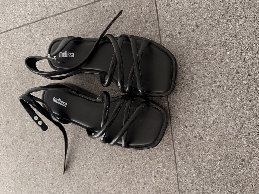Melissa Black Strappy Platform Sandals (Category: Flats & Sandals) located in Quezon City. Submitted by mynameismio (Listing ID 1468157955, Image 3). Description: - Brand: Melissa - Color: Black - Size: 6 - Style: Strappy platform sandals with chunky sole - Features: Multiple thin top straps, adjustable buckle ankle closure, signature insole branding - Condition: Clean, minimalist, and ready to wear.