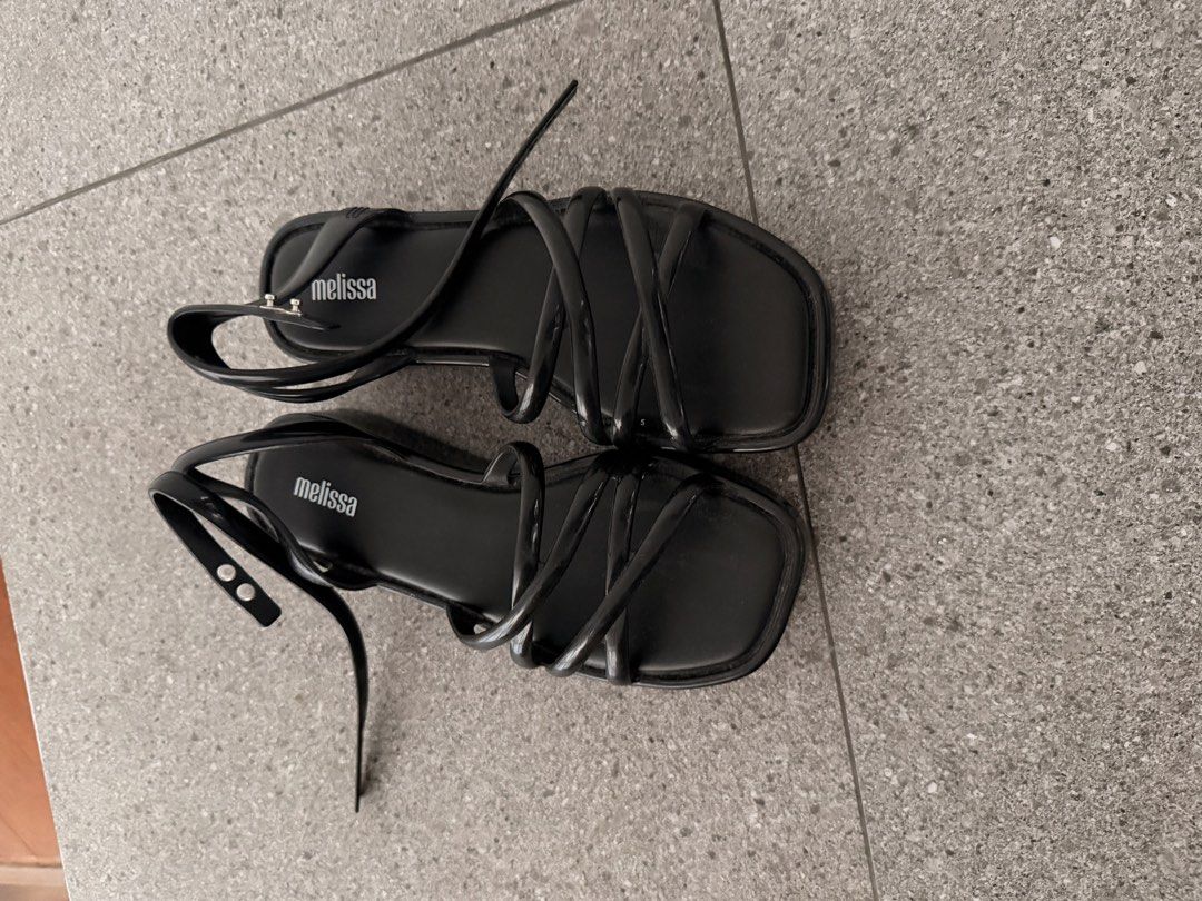 Melissa Black Strappy Platform Sandals (Category: Flats & Sandals) located in Quezon City. Submitted by mynameismio (Listing ID 1468157955, Image 2). Description: - Brand: Melissa - Color: Black - Size: 6 - Style: Strappy platform sandals with chunky sole - Features: Multiple thin top straps, adjustable buckle ankle closure, signature insole branding - Condition: Clean, minimalist, and ready to wear.