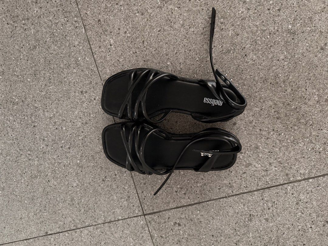 Melissa Black Strappy Platform Sandals (Category: Flats & Sandals) located in Quezon City. Submitted by mynameismio (Listing ID 1468157955, Image 1). Description: - Brand: Melissa - Color: Black - Size: 6 - Style: Strappy platform sandals with chunky sole - Features: Multiple thin top straps, adjustable buckle ankle closure, signature insole branding - Condition: Clean, minimalist, and ready to wear.