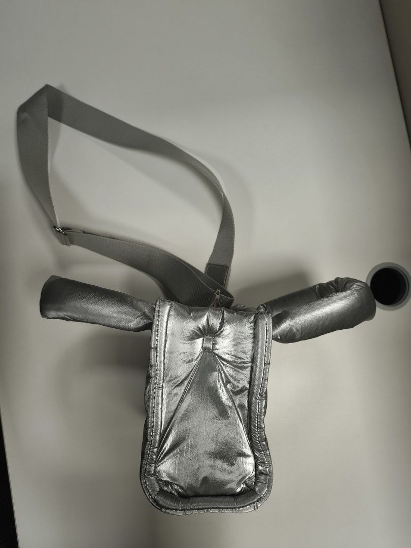 Metallic Silver Puffer Tote Bag with Crossbody Strap (Category: Tote Bags) located in Quezon City. Submitted by jdonor (Listing ID 1468095556, Image 3). Description: GU puff mini shoulder bag - Metallic silver quilted puffer tote bag - Dual structured top handles and adjustable webbed crossbody strap with silver hardware - Secure magnetic snap top closure - Clean interior lining with spacious open compartments - Lightweight and comfortable padded