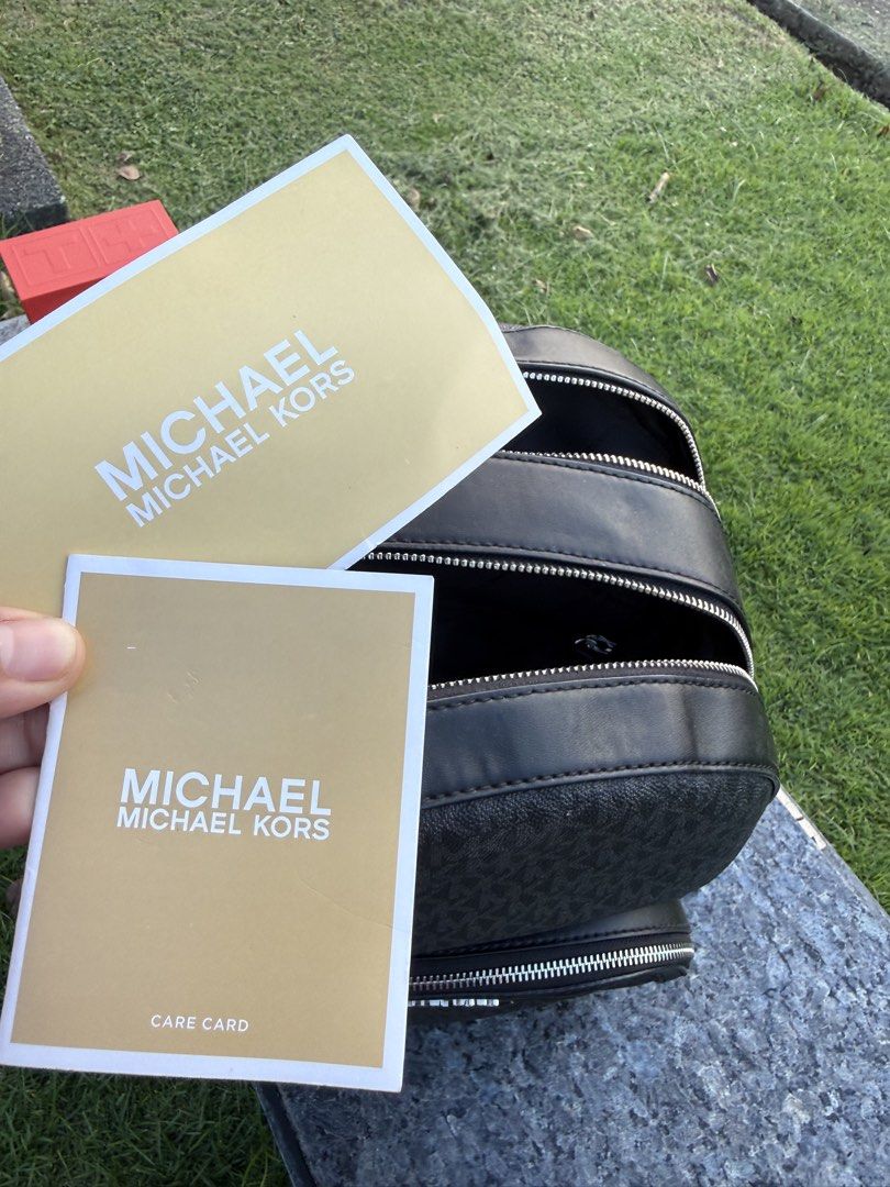 Michael Kors BackPack authentic (Category: Luxury Bags & Wallets) located in Quezon City. Submitted by kashbags (Listing ID 1468245523, Image 3). Description: Michael Kors Black Signature Backpack 🖤 💰 Selling Price: ₱3,200 Elevate your everyday style with this classic Michael Kors backpack in black signature monogram print! Sleek, timeless, and easy to pair with any outfit. ✨ Details: * Authentic Michael Kors design * Black signature MK monogra