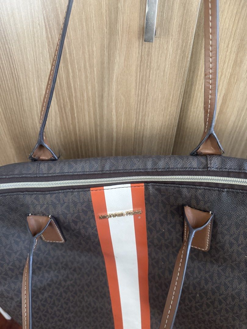 Michael Kors Bag (Category: Tote Bags) located in Manila. Submitted by prelovemd (Listing ID 1468102932, Image 3). Description: Large Travel bag from MK Authentic bag but no tags, no cc, paperbag Zoom in to see flaws and dirts / stains as shown on picture Cannot adjust the light but there are minimal chipped and dirt on the mid external lower front of the bag Zippers working well .