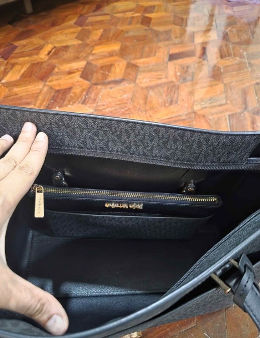 Michael Kors Black Monogram Tote Bag with Pouch (Category: Tote Bags) located in Quezon City. Submitted by allaboutyoused (Listing ID 1468182357, Image 3). Description: MK Charlotte 3in1 Large 3 Piece set Brand: Michael Kors - Color: Classic black monogram print - Hardware: Premium gold-tone with front logo medallion - Design: Structured shape with dual top handles - Interior: Clean lining with convenient zip and slip compartments - Inclusions: 1