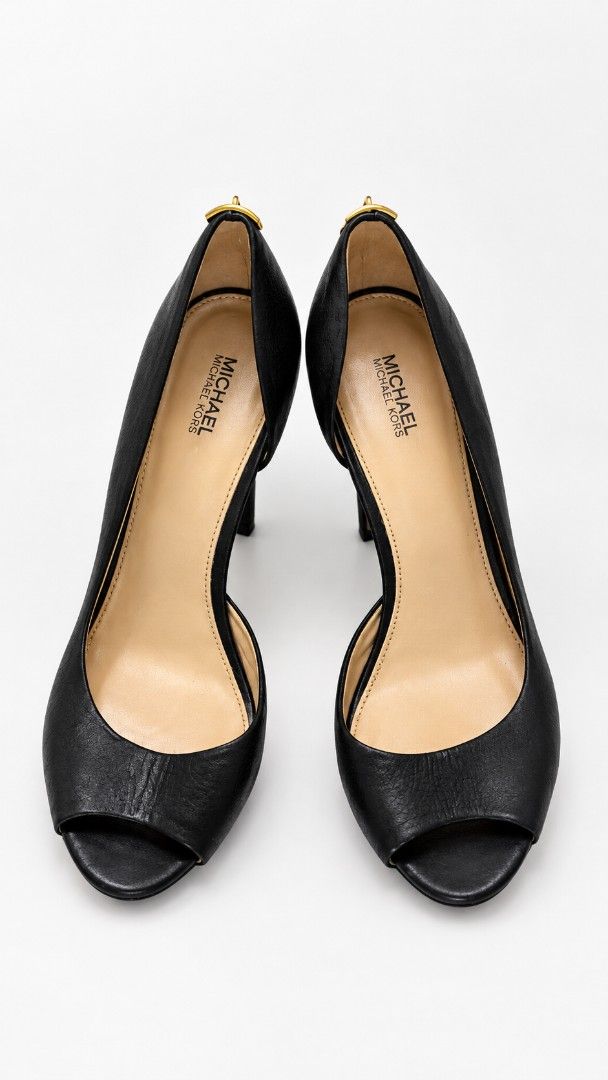 Michael Kors Black Peep-Toe Heels Size 8.5 (Category: Heels) located in Manila. Submitted by talishang_ (Listing ID 1468077804, Image 2). Description: - Brand: Michael Kors - Style: Peep-toe stiletto heels with gold padlock hardware - Color: Black with neutral lining - Size: 8.5M (US) / 39 (EU) - Condition: Very clean inside and out - Ideal for: Formal events, parties, and office wear.