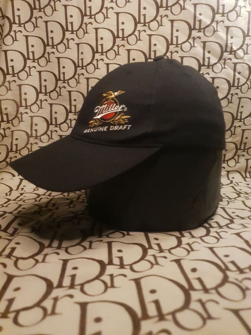 MILLER GENUINE DRAFT HARLEY DAVIDSON CAP (Category: Caps & Hats) located in San Fernando. Submitted by _jaximus (Listing ID 1468216384, Image 2). Description: - Color: Classic Black - Design: Embroidered Miller Genuine Draft logo on front, Harley Davidson shield on back - Material: 97% Cotton, 3% Spandex blend for a comfortable stretch - Size: One size fits most (stretch band) - Condition: Good pre-loved condition, previous owner's name written i