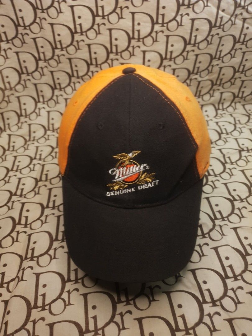 MILLER GENUINE DRAFT HARLEY DAVIDSON CAP (Category: Caps & Hats) located in San Fernando. Submitted by _jaximus (Listing ID 1468216667, Image 2). Description: - Color: Black and orange - Design: Miller Genuine Draft embroidery on front, Harley-Davidson logo on back - Fit: Flex fit style with an elastic sweatband (One size fits most) - Material: Comfortable cotton and spandex blend - Condition: Clean and well-kept.