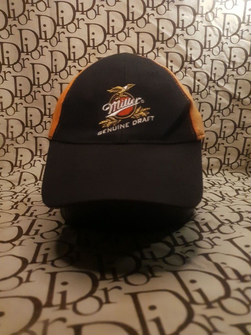 MILLER GENUINE DRAFT HARLEY DAVIDSON CAP (Category: Caps & Hats) located in San Fernando. Submitted by _jaximus (Listing ID 1468216667, Image 1). Description: - Color: Black and orange - Design: Miller Genuine Draft embroidery on front, Harley-Davidson logo on back - Fit: Flex fit style with an elastic sweatband (One size fits most) - Material: Comfortable cotton and spandex blend - Condition: Clean and well-kept.