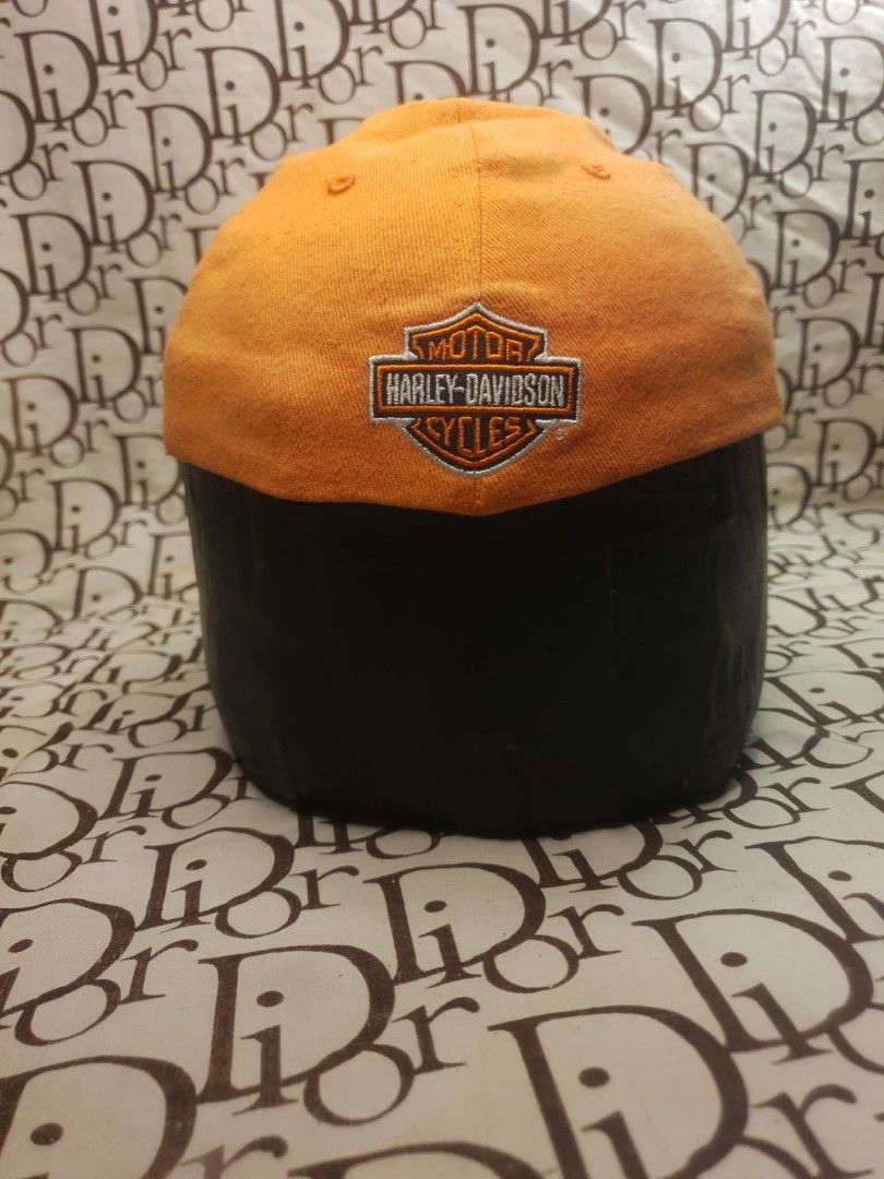 MILLER GENUINE DRAFT HARLEY DAVIDSON CAP (Category: Caps & Hats) located in San Fernando. Submitted by _jaximus (Listing ID 1468216667, Image 3). Description: - Color: Black and orange - Design: Miller Genuine Draft embroidery on front, Harley-Davidson logo on back - Fit: Flex fit style with an elastic sweatband (One size fits most) - Material: Comfortable cotton and spandex blend - Condition: Clean and well-kept.