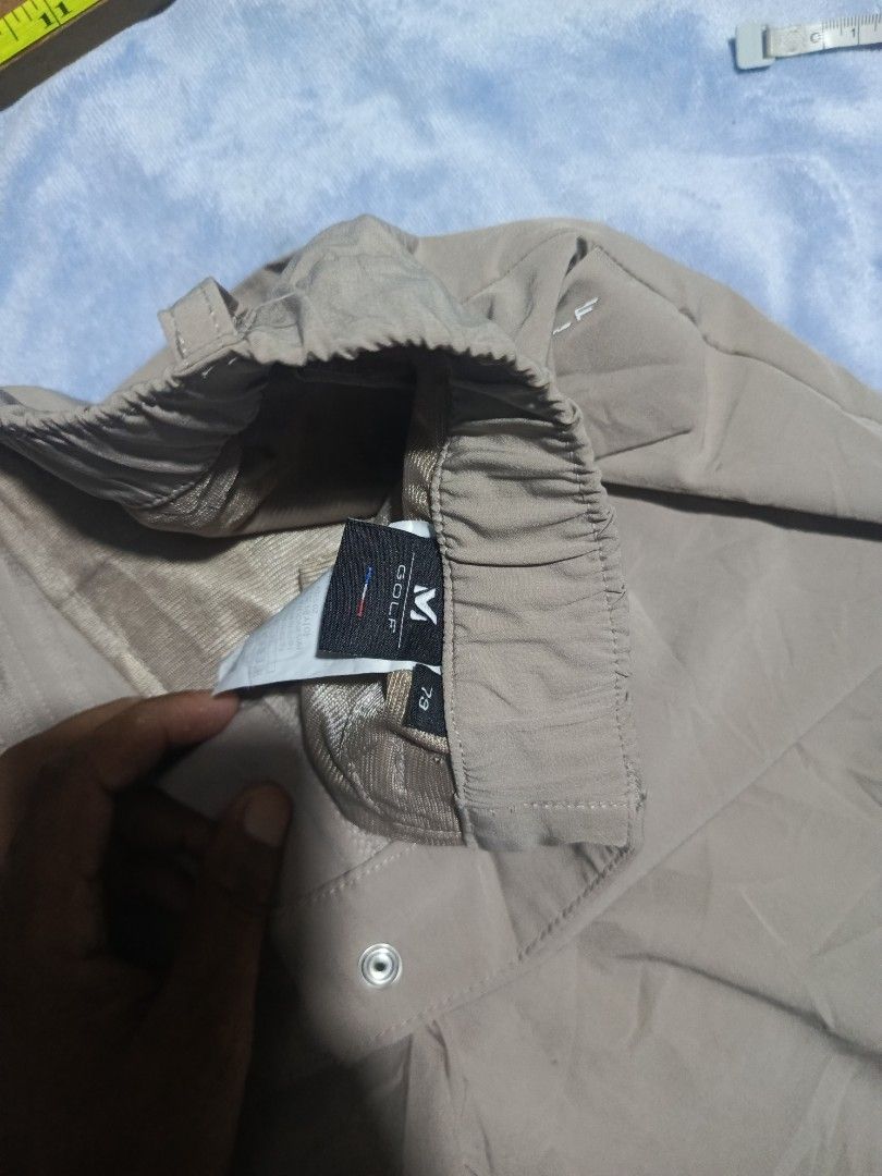 Millet Golf Beige Shorts Size 79 (Category: Shorts) located in City of Isabela. Submitted by warmbird.d06e6f (Listing ID 1468152746, Image 3). Description: - Brand/Model: Millet Golf Shorts - Color: Beige - Size: 79 - Waist: Elastic with button and zipper fly - Pockets: Front angled flap pockets and back welt pockets - Material: Lightweight and breathable - Condition/Fit: Great for golf or casual days (measurements in photos).