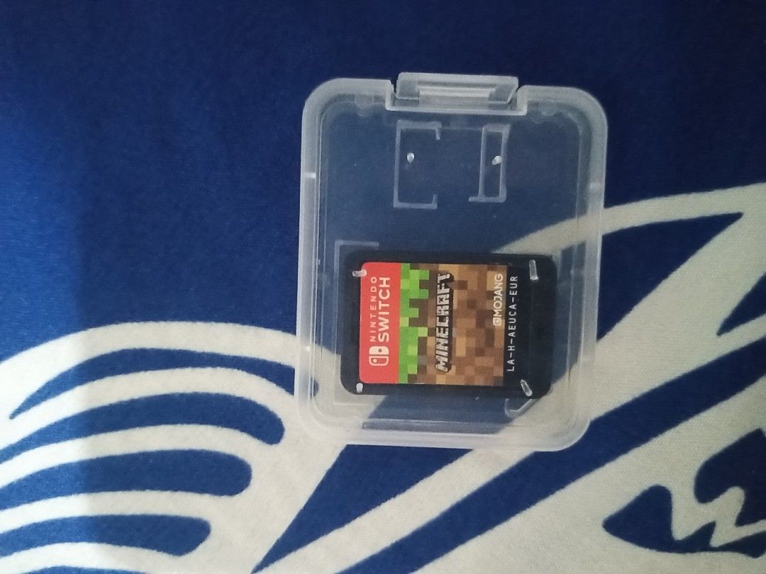 Minecraft Nintendo Switch Game Cartridge with Case (Category: Nintendo) located in Santo Tomas. Submitted by jirobautista (Listing ID 1468154515, Image 3). Description: - Game: Minecraft for Nintendo Switch (European version) - Condition: Excellent, clean and undamaged pins - Extras: Includes free clear plastic protective case - Status: 100% working and ready to play Nintendo switch Minecraft - 800 loc: bitin, bay, laguna (36V8+Q86, Bay, Laguna, 