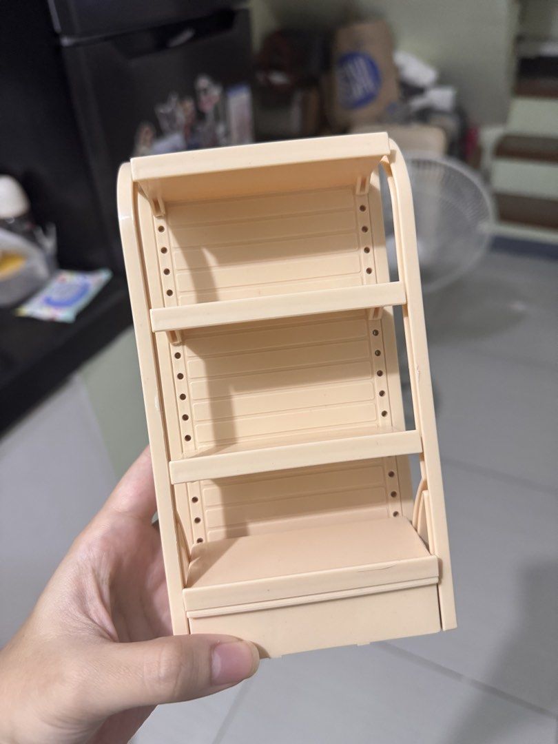 Mini Figure Display Shelf Storage Rack (Category: Shelves, Cabinets & Racks) located in Rizal. Submitted by jmjrdo (Listing ID 1468223312, Image 2). Description: Mini Figure Display Shelf Storage Rack 150 each - Color: Beige Purple Pink Green - Easy snap-together plastic assembly - Ideal desktop organizer for blind box figures, gachapon, and small toys .