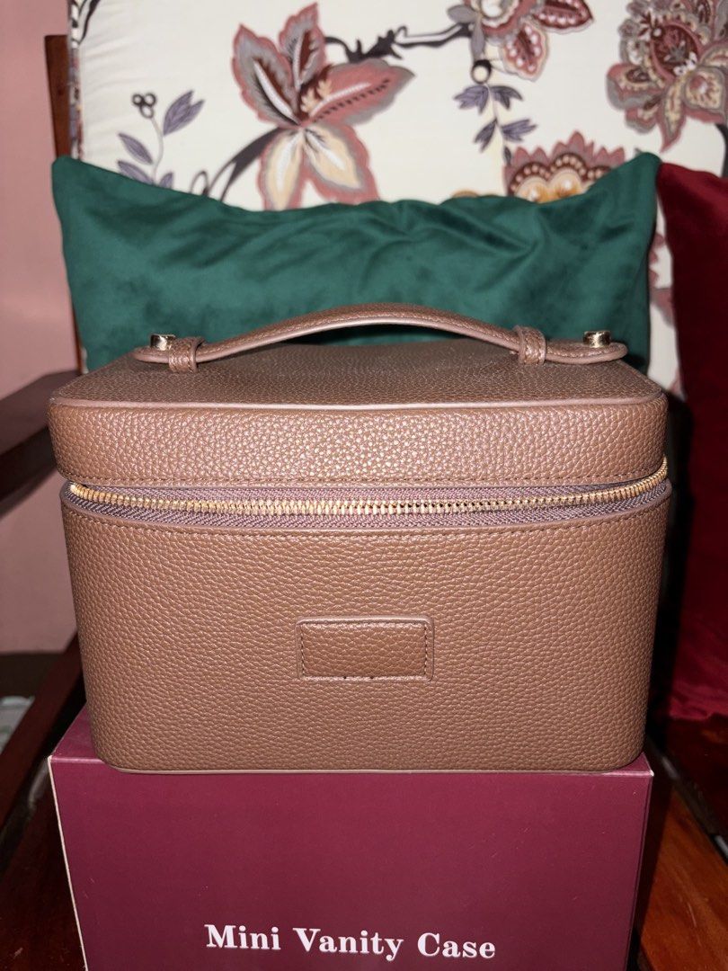 Mini Vanity Case Makeup Bag (Brown) (Category: Purses & Pouches) located in Rizal. Submitted by monikanik_ (Listing ID 1468180852, Image 1). Description: - spacious makeup vanity bag with removable divider - stain resistant - intact zipper - used once only for travelling as this is my extra makeup bag - bought via ig - will give freebie non used makeup! - dm for more details 🏷️ price still negotiable!.