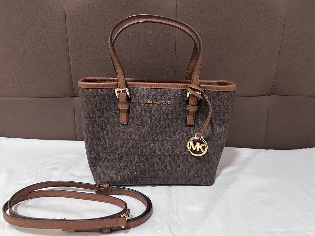 MK Jet set Travel (Category: Luxury Bags & Wallets) located in Cabanatuan. Submitted by hellorhea (Listing ID 1468218697, Image 1). Description: Good as new. No flaws Removable strap .