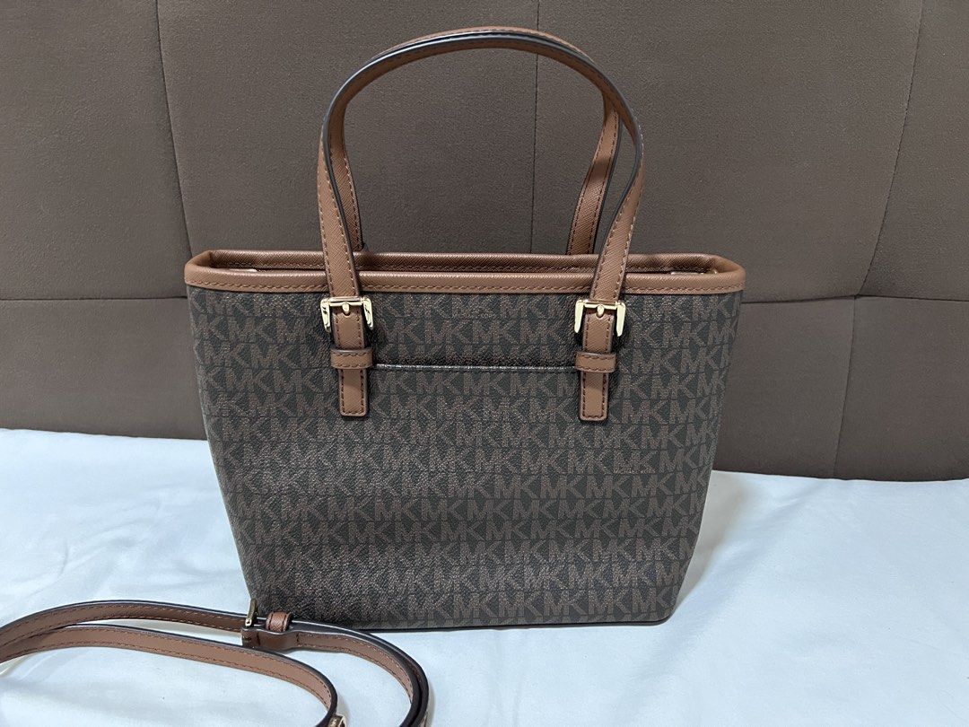 MK Jet set Travel (Category: Luxury Bags & Wallets) located in Cabanatuan. Submitted by hellorhea (Listing ID 1468218697, Image 3). Description: Good as new. No flaws Removable strap .