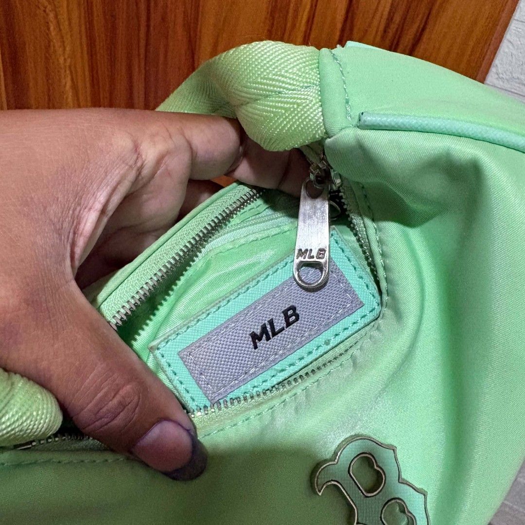 MLB Boston Red Sox Green Nylon Shoulder Bag (Category: Shoulder Bags) located in Carmen. Submitted by ar_thrift00 (Listing ID 1468282655, Image 3). Description: - MLB Boston Red Sox shoulder bag - Vibrant green nylon material with silver 'B' logo - Compact single-strap design for daily use - Custom branded zipper pullers - Green fabric-lined interior with a secure zipper pocket - Official MLB woven patch inside - Style number: 3AB0S032N - Conditi