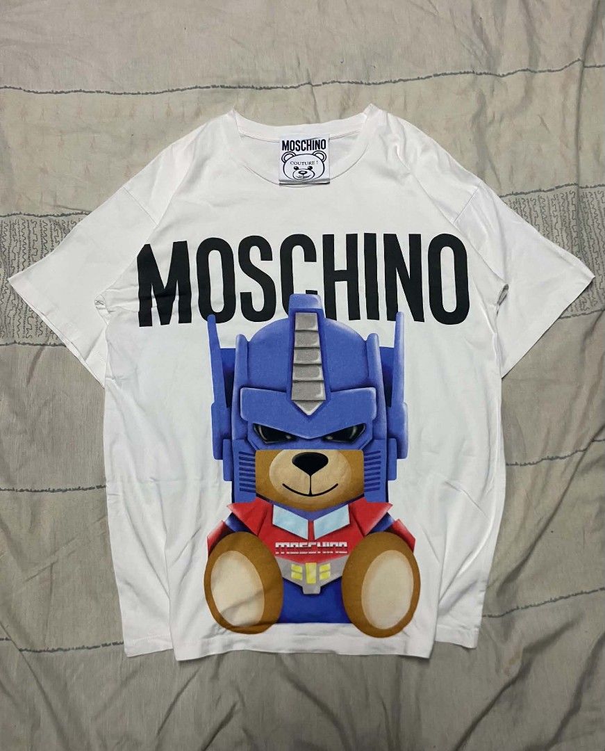Moschino Optimus Prime AOP (Category: Luxury Apparel) located in Manila. Submitted by kayzthawan (Listing ID 1468148953, Image 1). Description: ₱450.00 💎Moschino Optimus Prime AOP Size : Large Dimes : 21 x 28 Condition : Excellent Condition : 9.5 Issue : None.