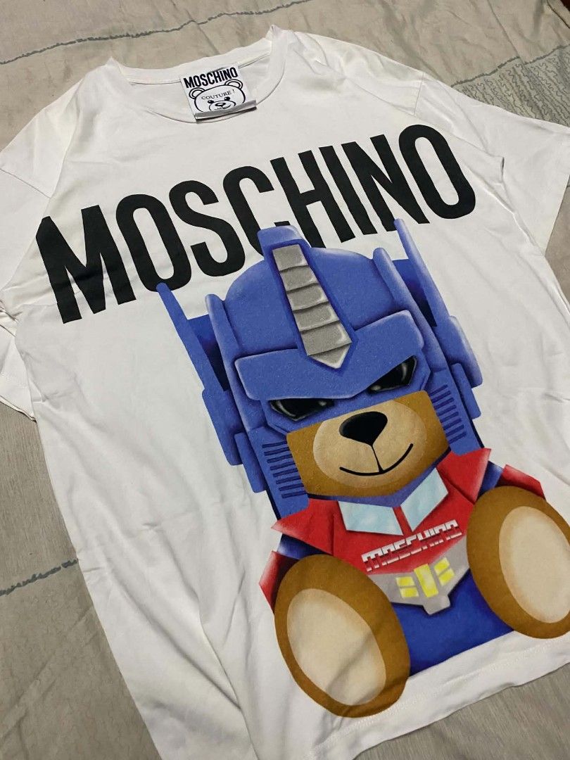 Moschino Optimus Prime AOP (Category: Luxury Apparel) located in Manila. Submitted by kayzthawan (Listing ID 1468148953, Image 2). Description: ₱450.00 💎Moschino Optimus Prime AOP Size : Large Dimes : 21 x 28 Condition : Excellent Condition : 9.5 Issue : None.