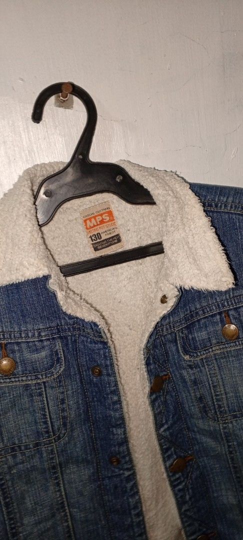 MPS Denim Sherpa Jacket Size 130 (Category: Coats, Jackets and Outerwear) located in Manila. Submitted by ezekislacl02490 (Listing ID 1468282922, Image 2). Description: - Brand/Model: MPS denim jacket for kids - Lining: Cozy white sherpa fleece interior and collar for extra warmth - Details: Bronze-tone metal buttons and functional chest pockets - Size: 130 (tagged inside collar) - Style: Classic blue wash outer - Condition/Use: Great winter oute