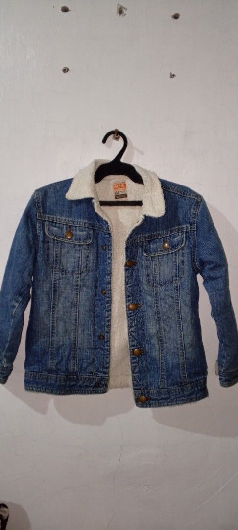 MPS Denim Sherpa Jacket Size 130 (Category: Coats, Jackets and Outerwear) located in Manila. Submitted by ezekislacl02490 (Listing ID 1468282922, Image 1). Description: - Brand/Model: MPS denim jacket for kids - Lining: Cozy white sherpa fleece interior and collar for extra warmth - Details: Bronze-tone metal buttons and functional chest pockets - Size: 130 (tagged inside collar) - Style: Classic blue wash outer - Condition/Use: Great winter oute