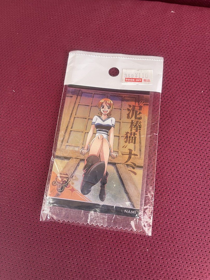 Nami (Category: Raw Singles) located in Manila. Submitted by dstrangerthings (Listing ID 1468233678, Image 3). Description: - Authentic Bandai One Piece Trading Card Game featuring Nami - Features stunning Nami artwork with Japanese text and the Straw Hat Pirates skull logo - 100% Made in Japan - Perfect for One Piece TCG players and Nami collectors!.