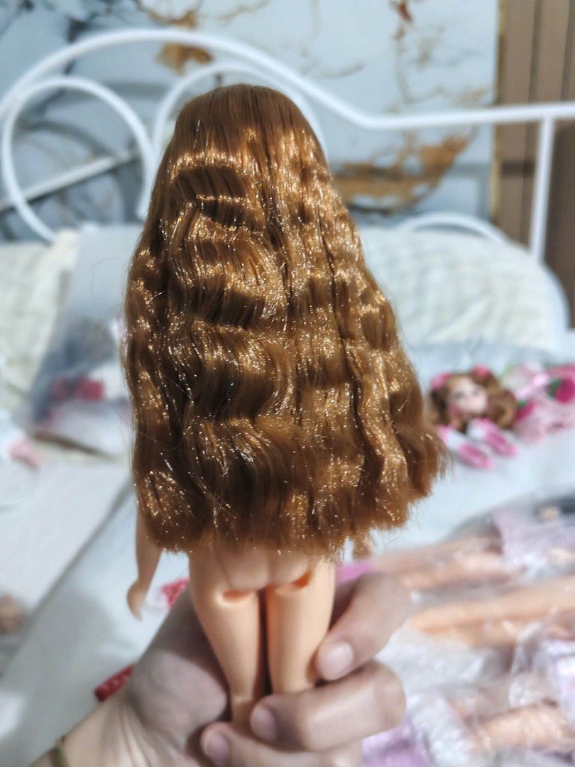 NAOMI Doll Nude (Category: Kids Toys) located in Rizal. Submitted by kws_onlineshop (Listing ID 1468150635, Image 3). Description: - Collectible NAOMI fashion doll - Long wavy brown hair with subtle sparkle threads - Detailed painted facial features, pink lips, and dark eyes - Articulated body structure for posing loc imus cavite - Nude doll (no clothing included) - Clean overall condition with minimal handling marks - Ideal for doll displays or 