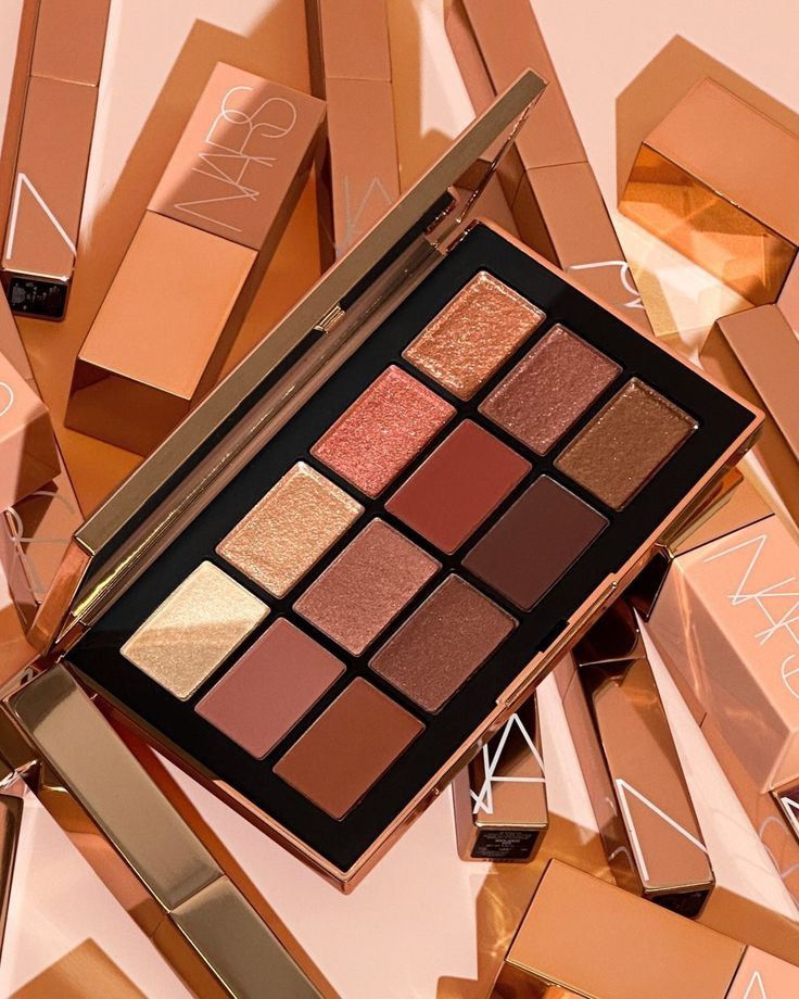 NARS After Glow Eyeshadow Palette (Category: Makeup) located in Pasig City. Submitted by bitofahoarder (Listing ID 1467914073, Image 1). Description: - Brand: NARS - 12 diverse shades including mattes and shimmers - Color range: Bronze, pink, purple, and neutral tones - Packaging: Original metallic bronze box included - Features: Built-in mirror inside the lid for easy retouching - Versatile: Great for everyday neutrals and vibrant pop looks Bran