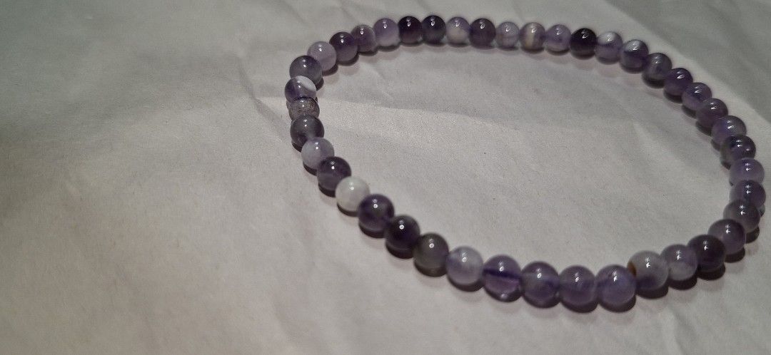 Natural Amethyst Crystal Beaded Stretch Bracelet (Category: Bracelets) located in Quezon City. Submitted by satin_heart2026 (Listing ID 1468237963, Image 2). Description: - Made with 100% natural amethyst crystals - Features a unique single white accent bead - Securely strung on durable stretch cord - Comfortable fit for most wrist sizes - Perfect for daily wear and crystal healing - made by canadian jeweler.