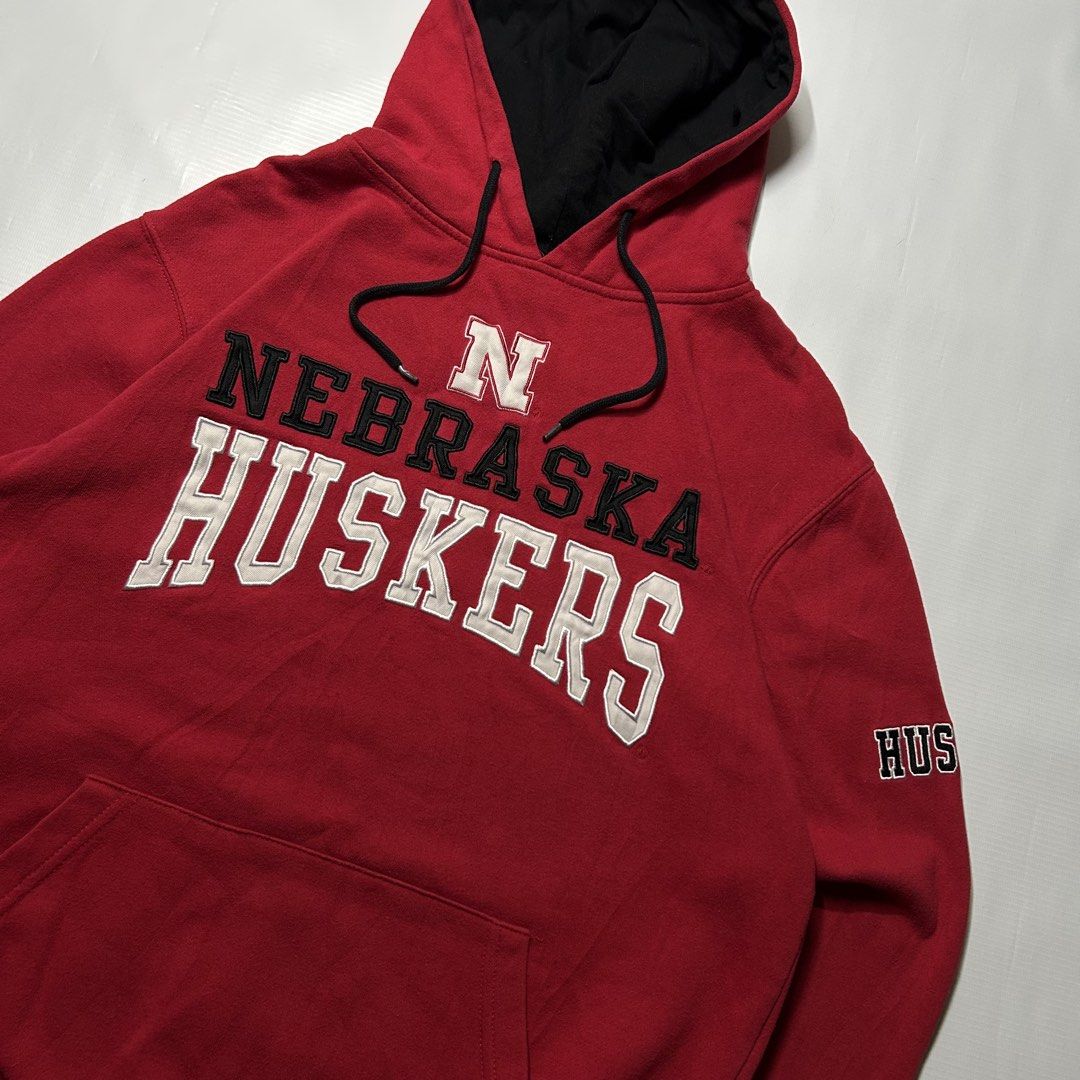 Nebraska Embroidered Hoodie (Category: Hoodies) located in Antipolo. Submitted by wvyfrnds (Listing ID 1468220033, Image 2). Description: Nebraska Embroidered Hoodie Size: M Color: Red Dimensions (Inches): Length: 24.5 Width: 21 Color Rate: 9/10 Issues - Ink stain at the back of hood 395 PLUS SF.